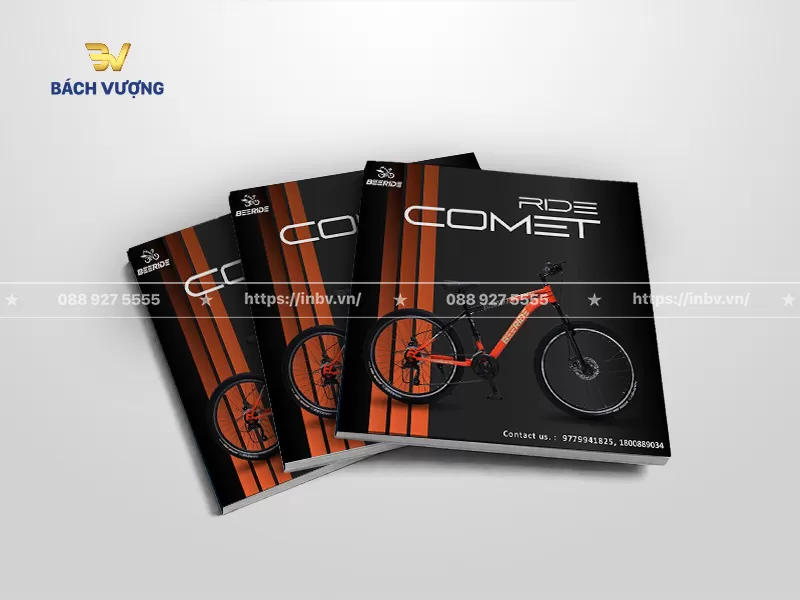 mẫu catalogue xe đạp thể thao địa h&igrave;nh tone đen chủ đạo với dải cam rực rỡ chạy dọc tạo điểm nhấn thị gi&aacute;c bứt ph&aacute;